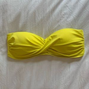 Neon yellow strapless bathing suit top.